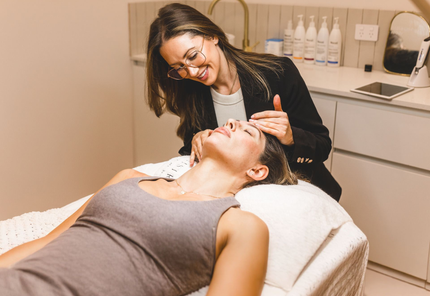 Tijan is assessing a client's face at Wollongong Skin Clinic