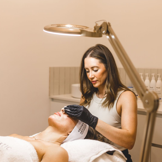 Tijan is treating a client at Aesthetic Artistry Skin Clinic in Wollongong