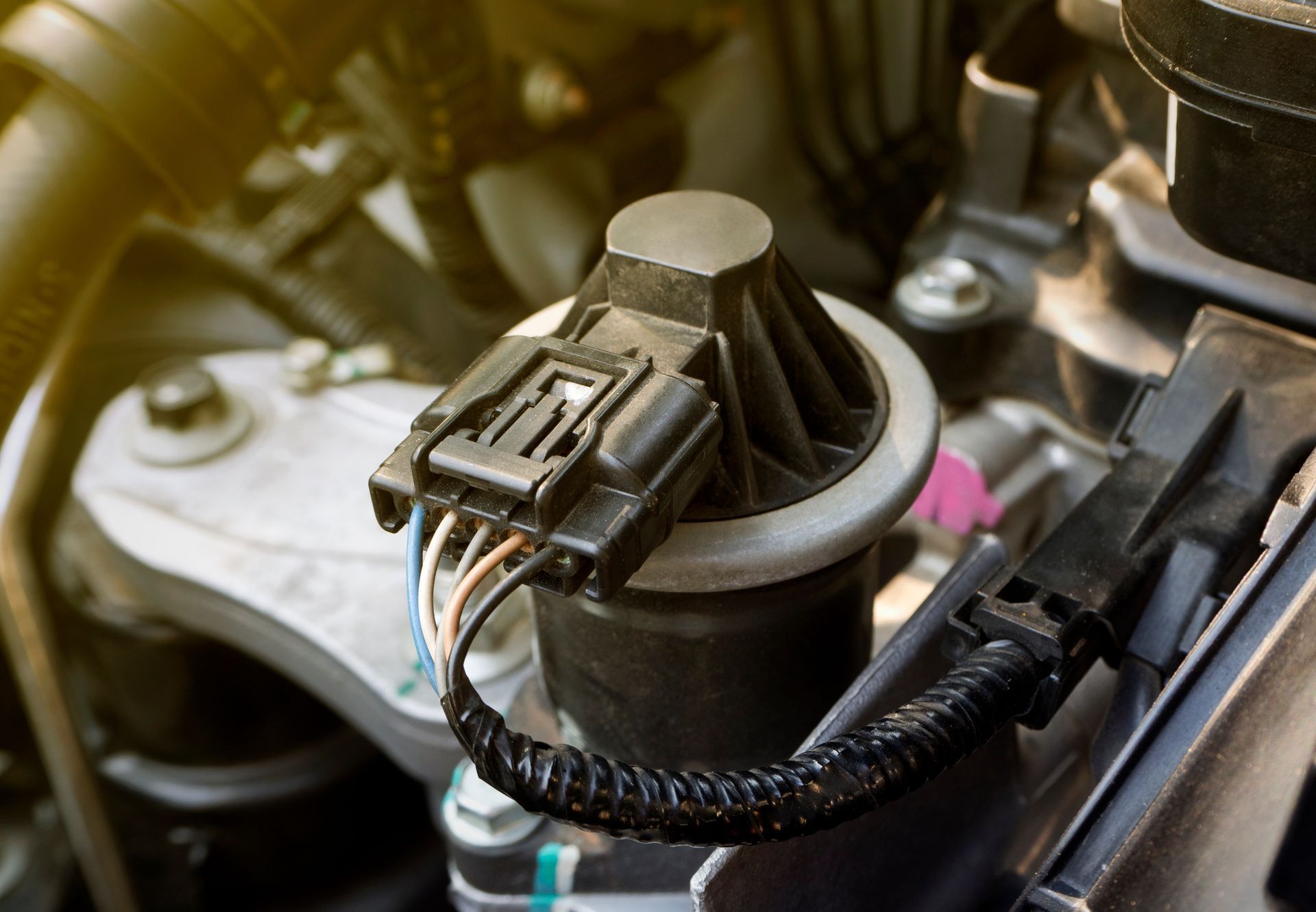 Close-up of a car engine component | Custom Performance Center