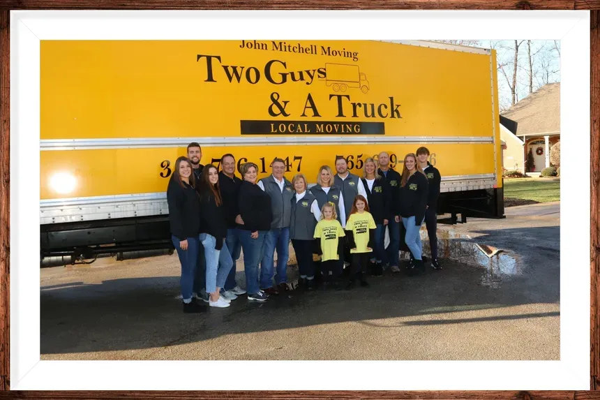 Whole Family — Anderson, IN — John Mitchell Moving Two Guys & A Truck A packing services team outside a moving truck in Indianapolis, IN
