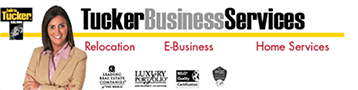 A woman is standing in front of a banner for tucker business services