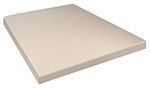 A white mattress is sitting on top of a white surface.