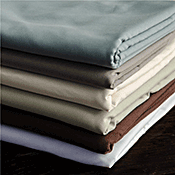 A pile of sheets of different colors are stacked on top of each other