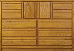 A close up of a wooden dresser with many drawers.