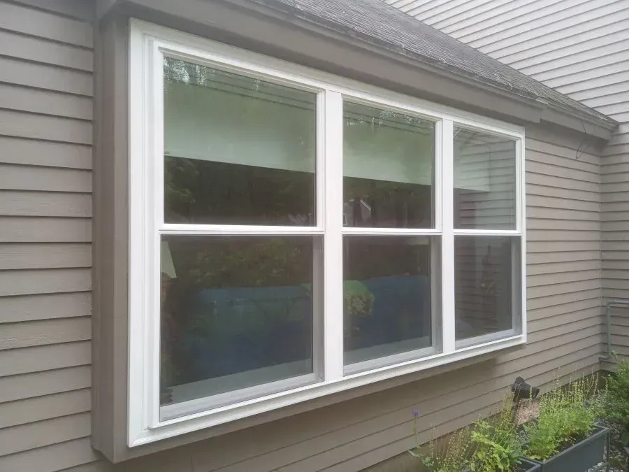 A large window on the side of a house.