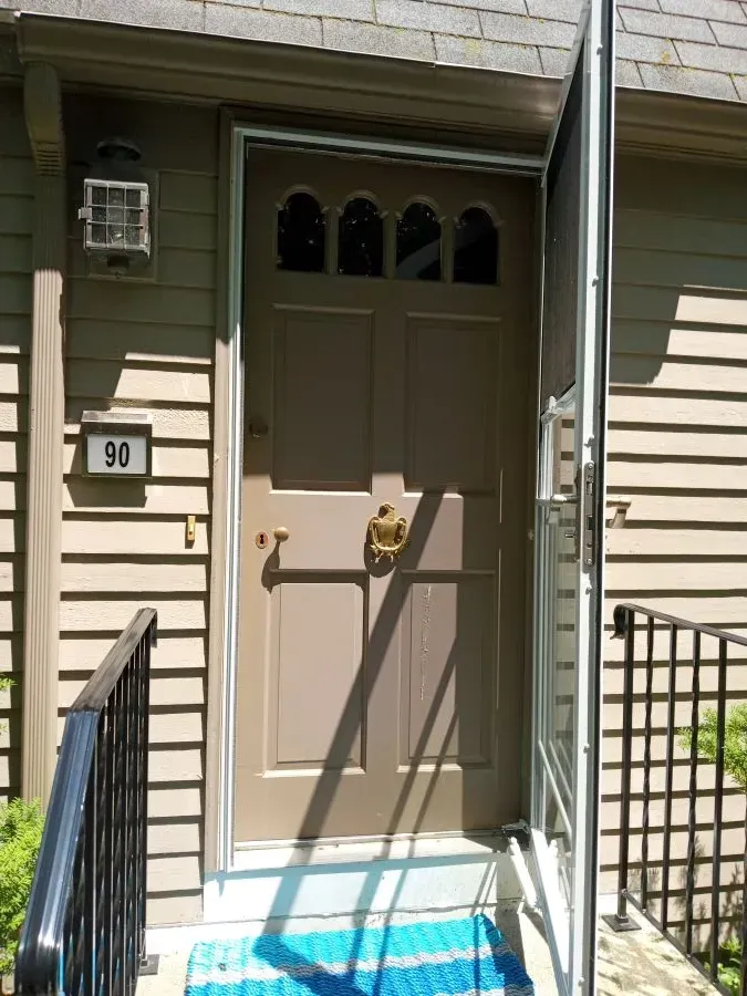 The front door of a house with the number 93 on it