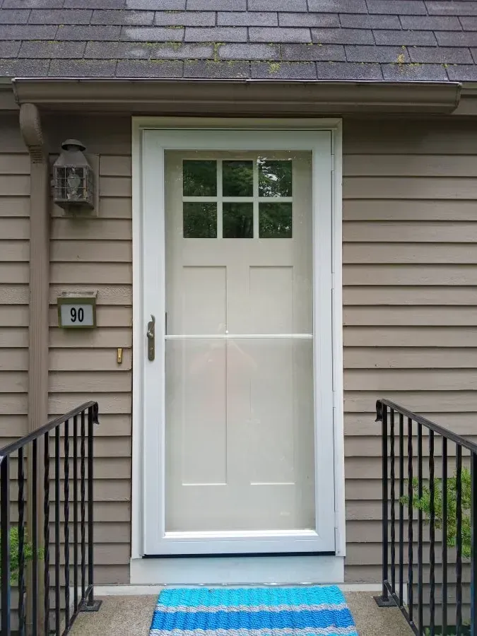 The front door of a house with the number 90 on it