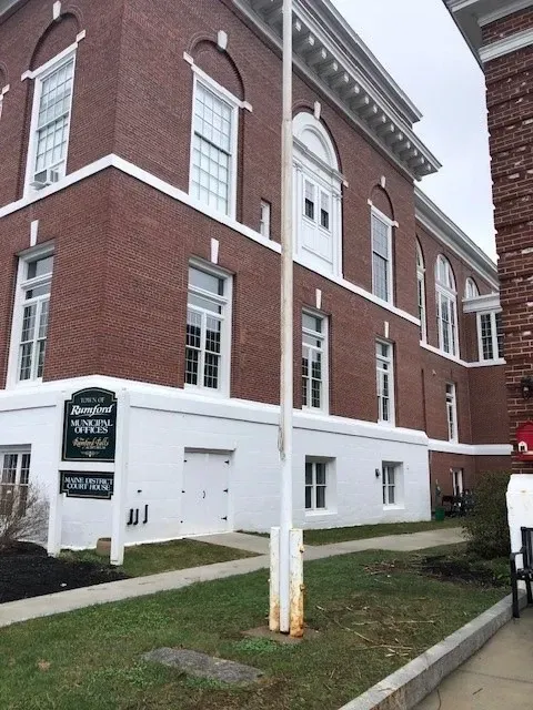 Brick building with white trim, sign says “Somersworth Historic Association.”