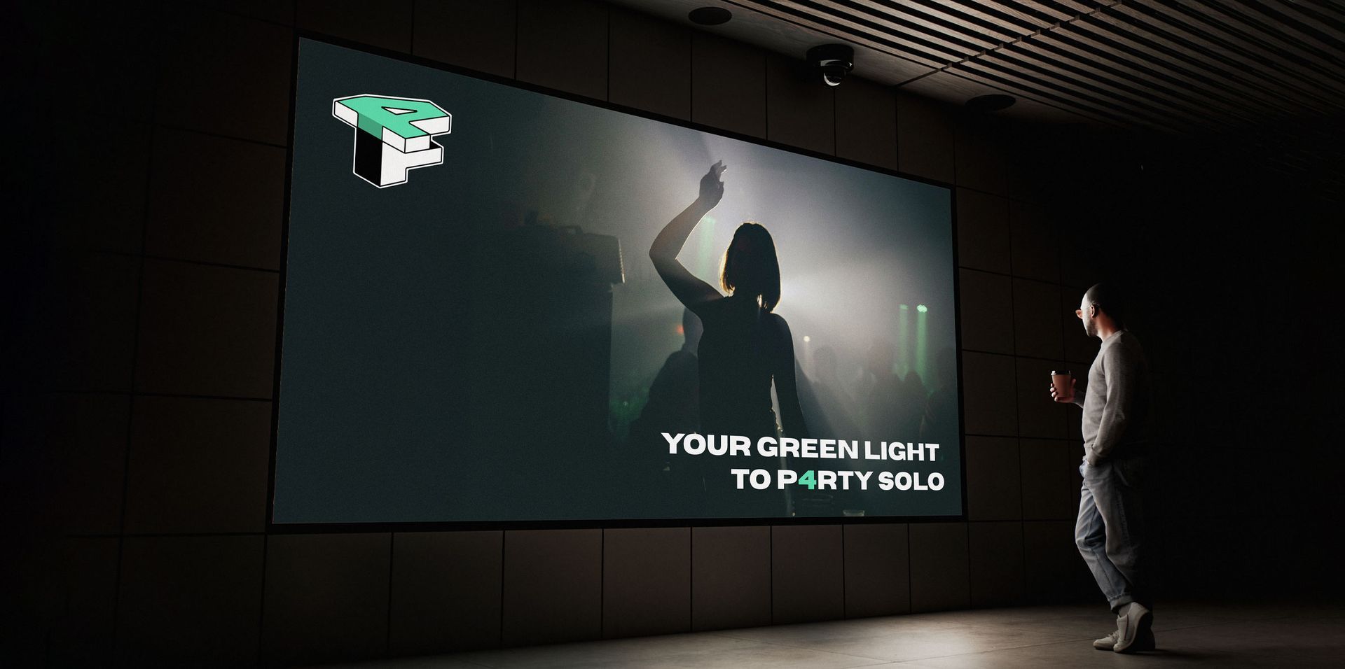 Person facing a large dark screen with a silhouetted figure and the text “YOUR GREATEST TODAY SOLD.”