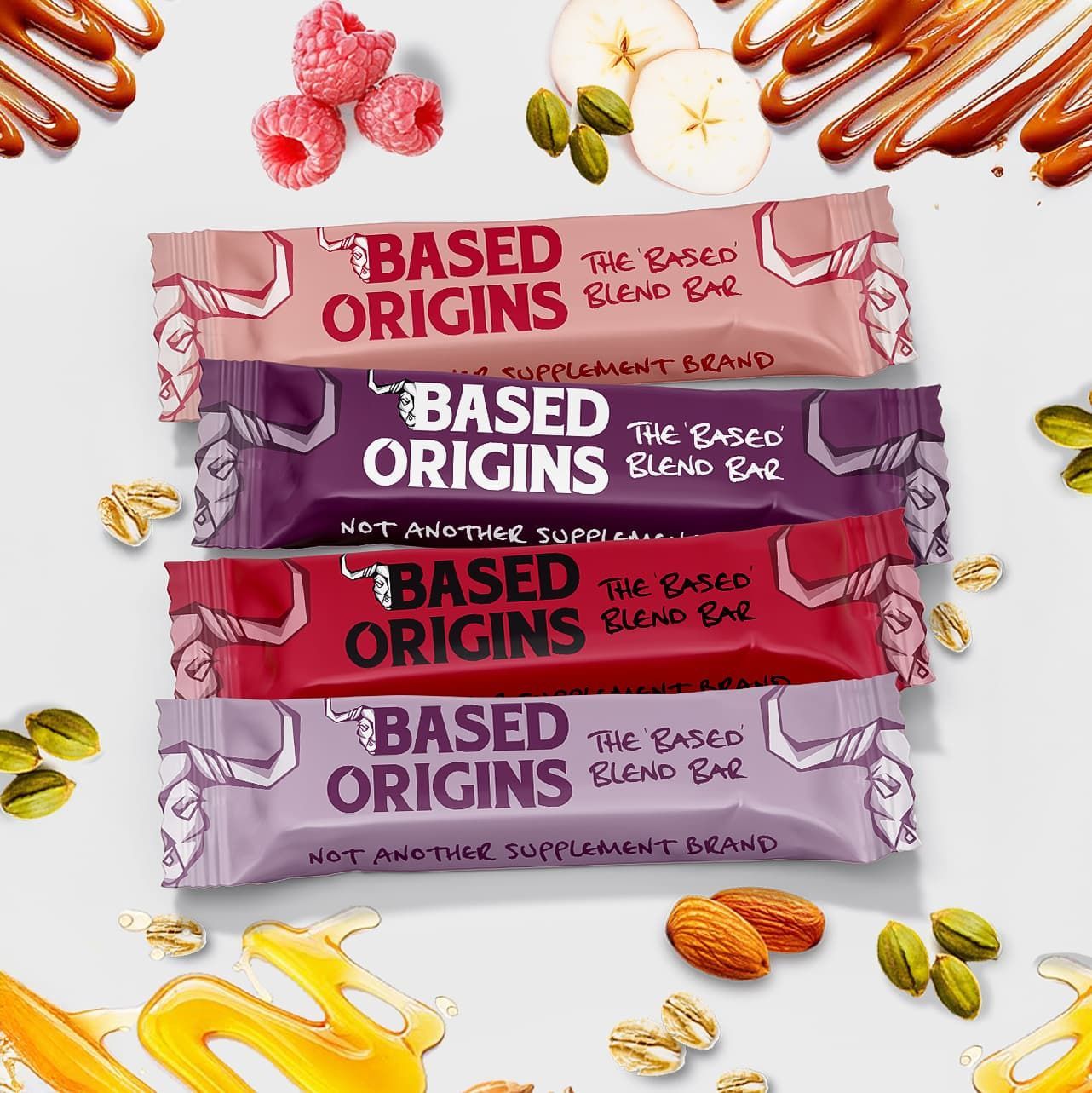 Assorted Based Origins snack bars in pink, purple, and red wrappers with nuts scattered around them