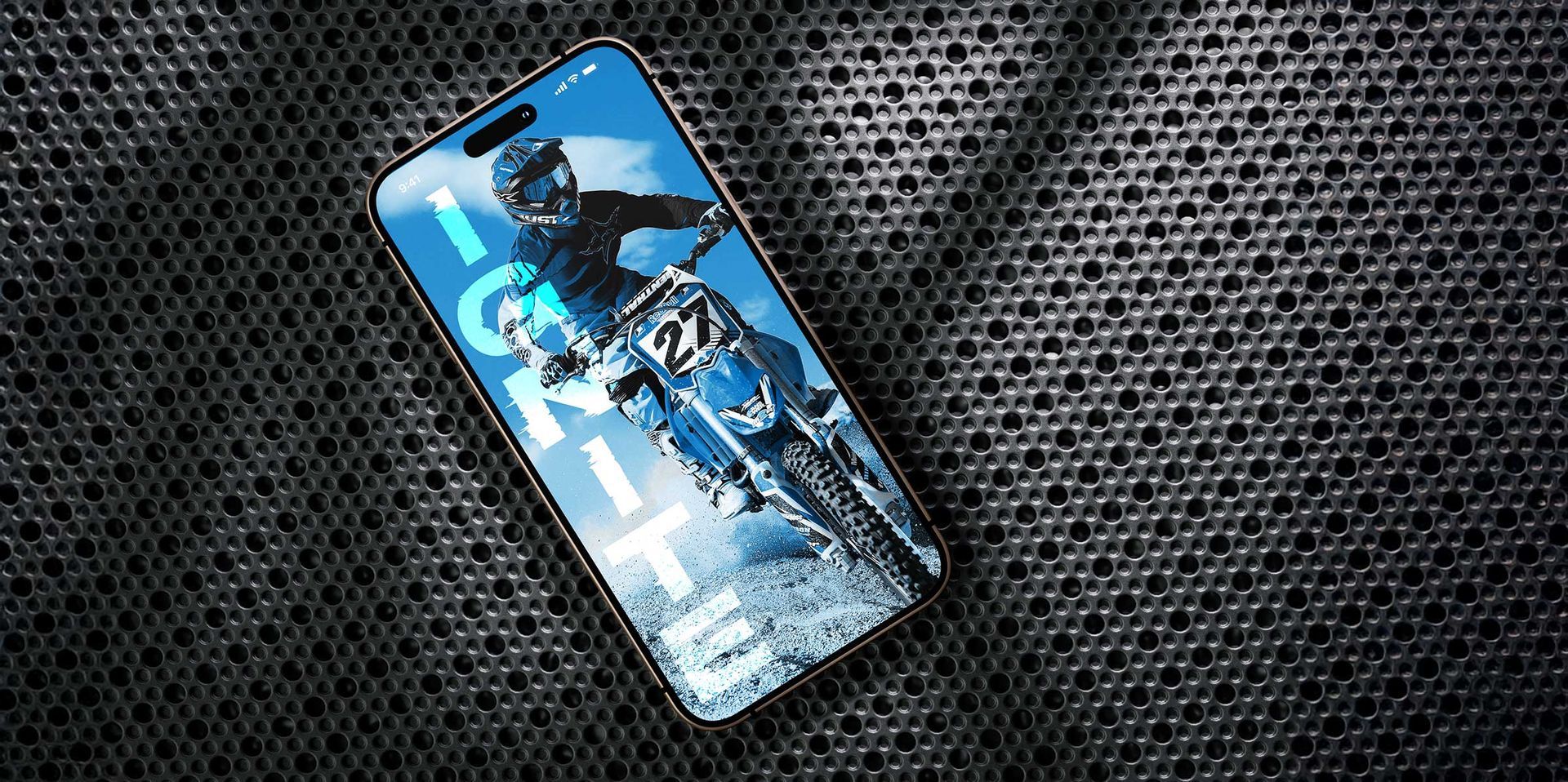 Blue motocross rider on a tilted smartphone screen against a dark textured background
