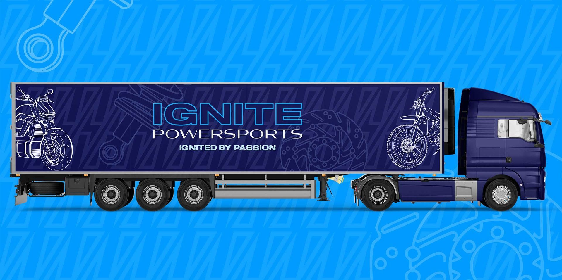 Blue semi-truck trailer with neon “Ignite” graphics on a light blue background
