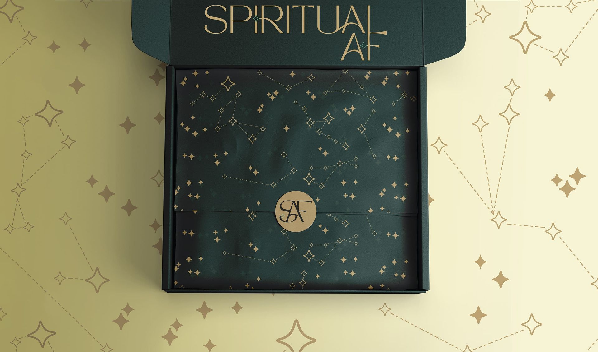 Dark teal notebook with gold star pattern and “SPIRITUAL AF” on the cover, on a light patterned surface