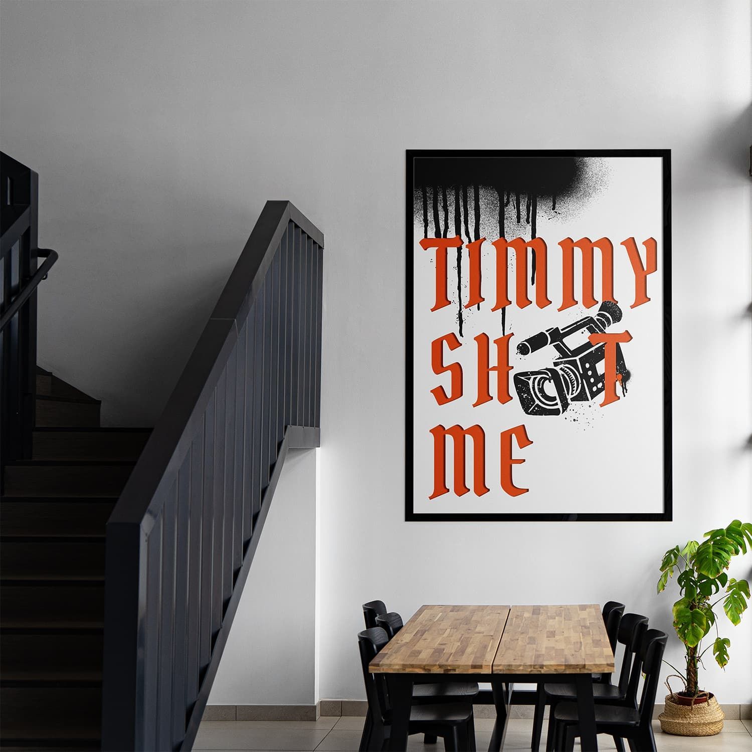 Modern stairway beside a bench and plant, with a framed poster reading “Timmy Shot Me” on the wall