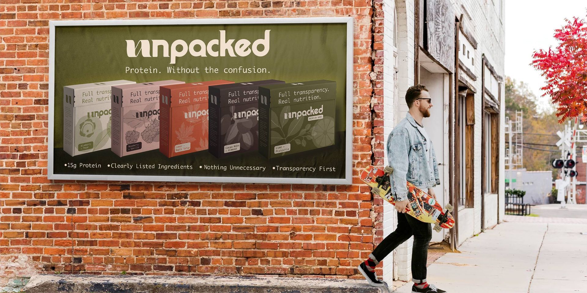 Man walking past a brick wall with a large “tinpacked” advertisement billboard on a city sidewalk