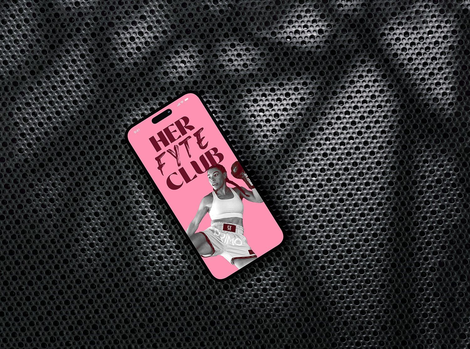 iPhone on black metal, with a female kickboxer  and bold black text.