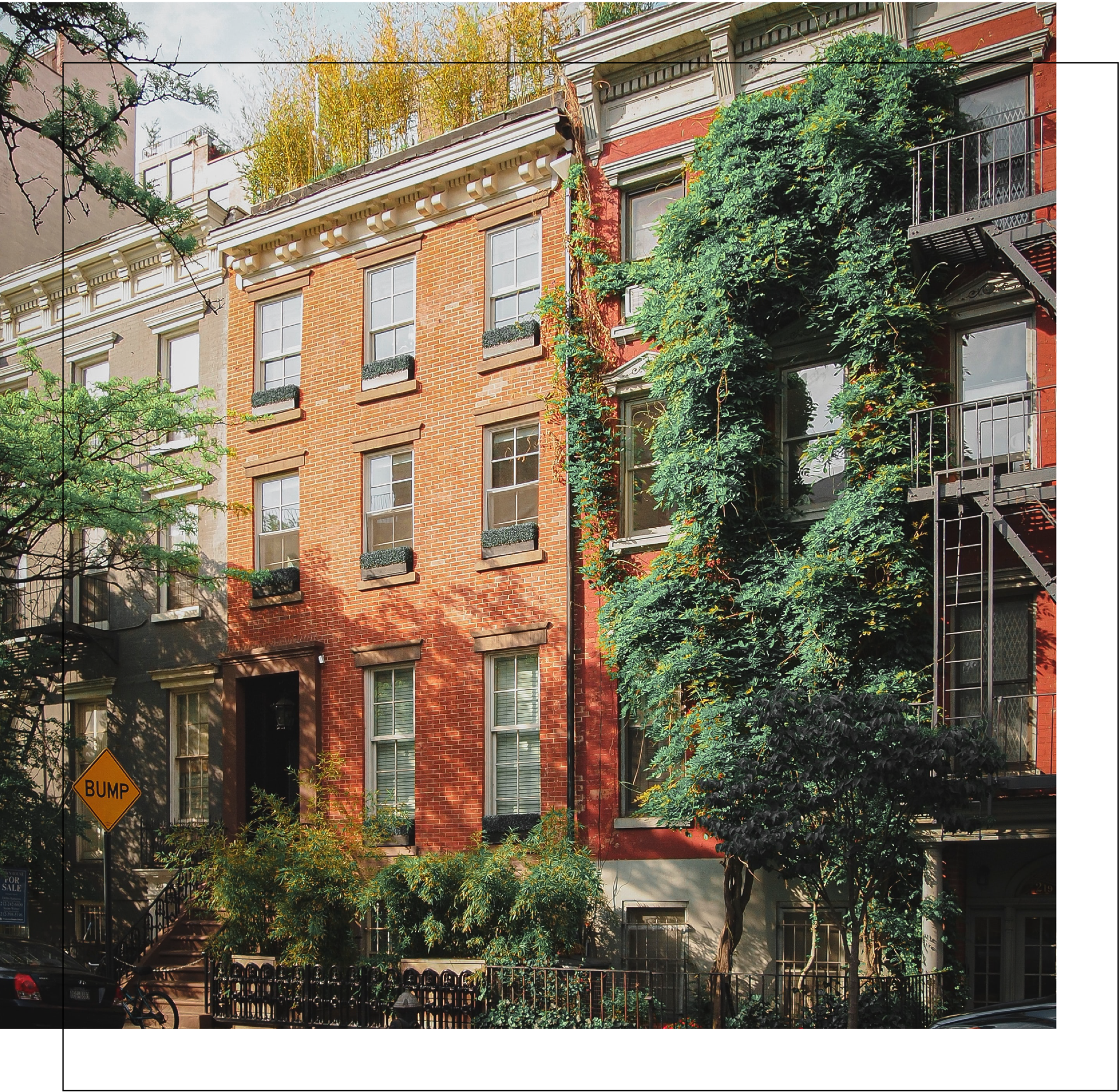 A row of brick buildings with a fire escape