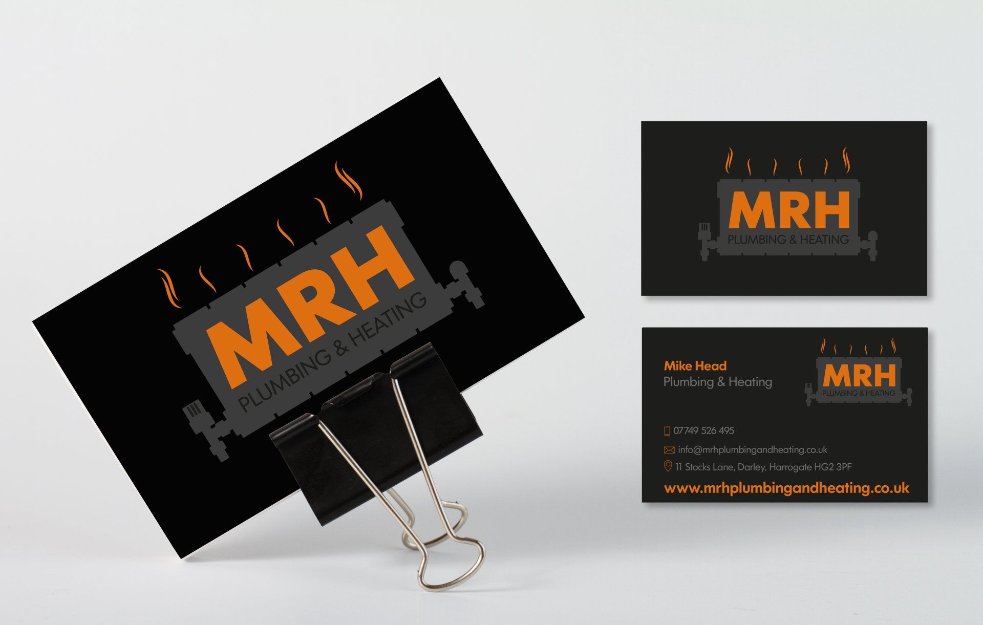 A business card for mrh plumbing and heating