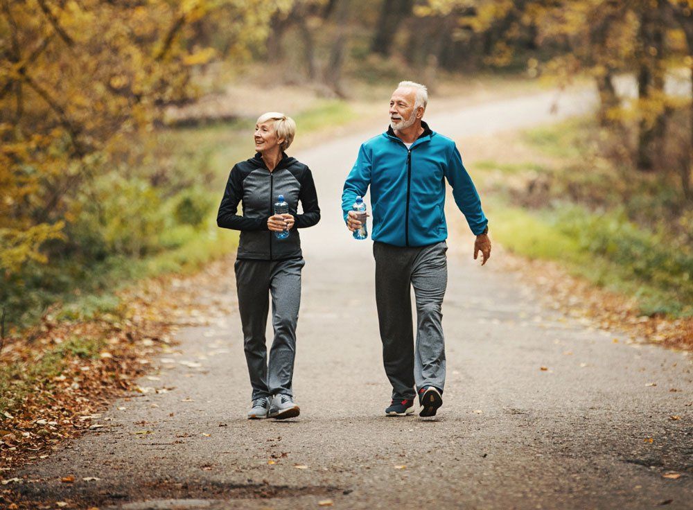 Couple Walking Together — Bullhead City, AZ — J.L. Artificial Limb & Brace Couple Walking Together — Bullhead City, AZ — J.L. Artificial Limb & Brace