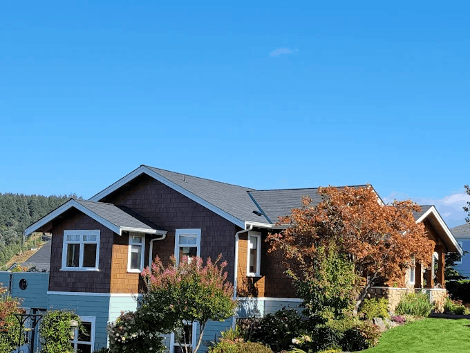 New asphalt shingle roof on modern home
