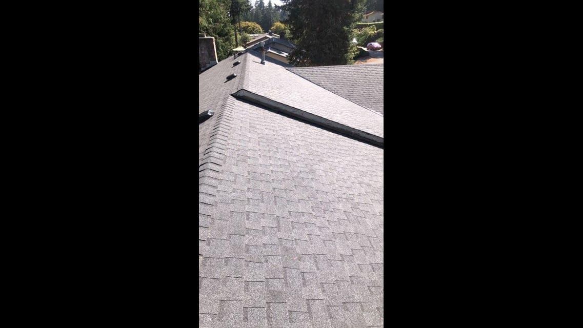 Completed asphalt shingle roof with ridge vent