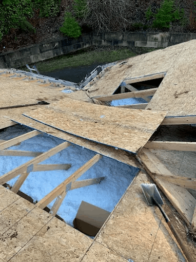 Damaged roof decking removed and prepared for repair
