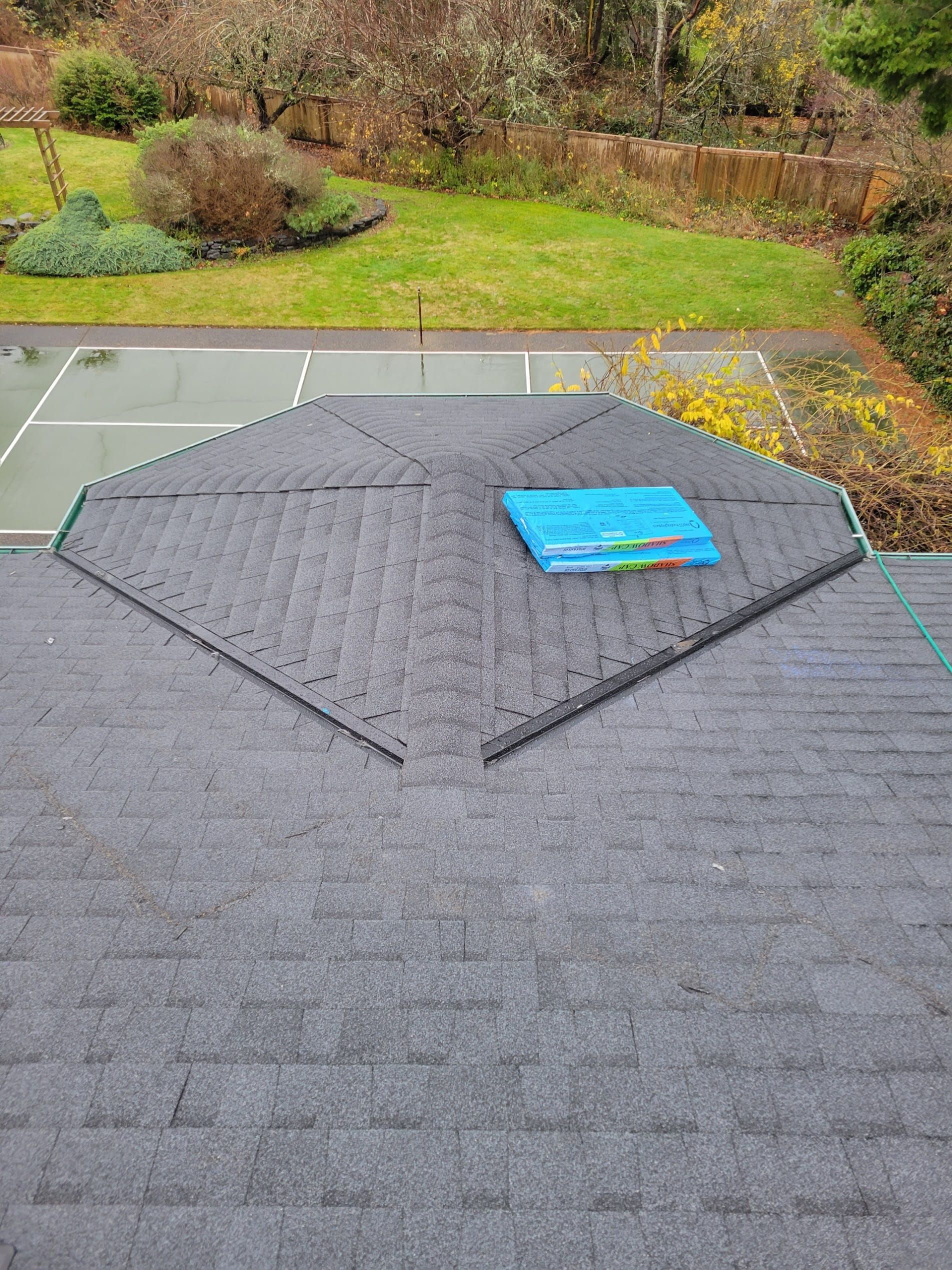 Roof replacement project with temporary protective tarp