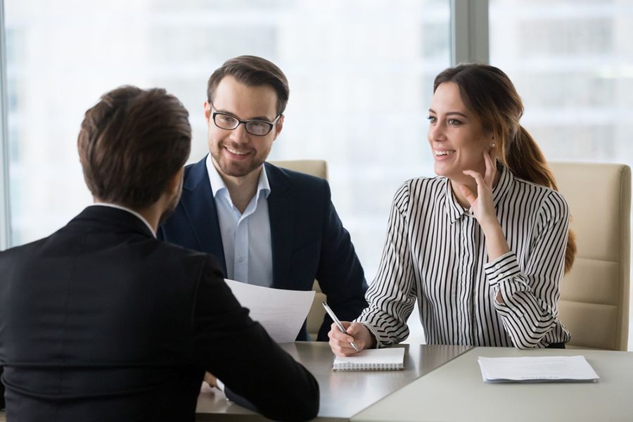 A Man and a Woman Are Sitting at a Table Having a Job Interview — Search Partners in Melbourne, VIC