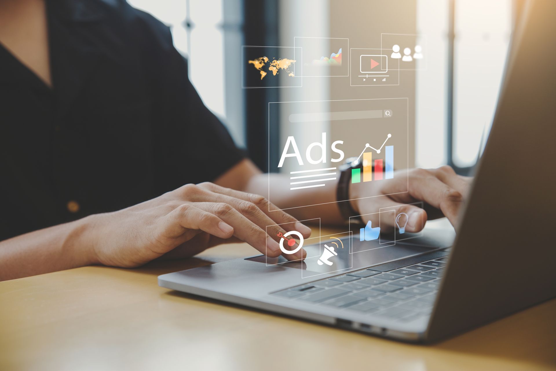 Person typing on a laptop with overlaid digital advertising data visualizations, the word