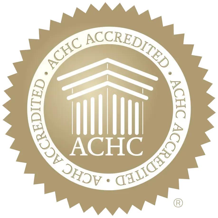 ACHC accreditation seal: Gold seal with text 