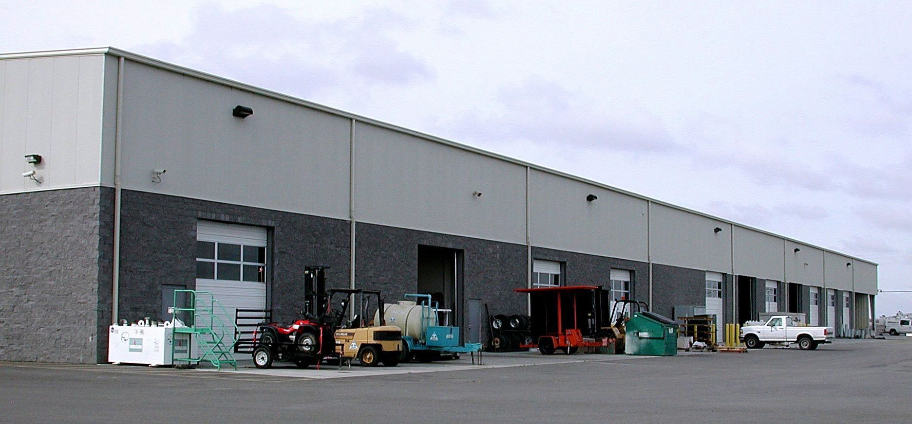 a building with a lot of trucks parked in front of it