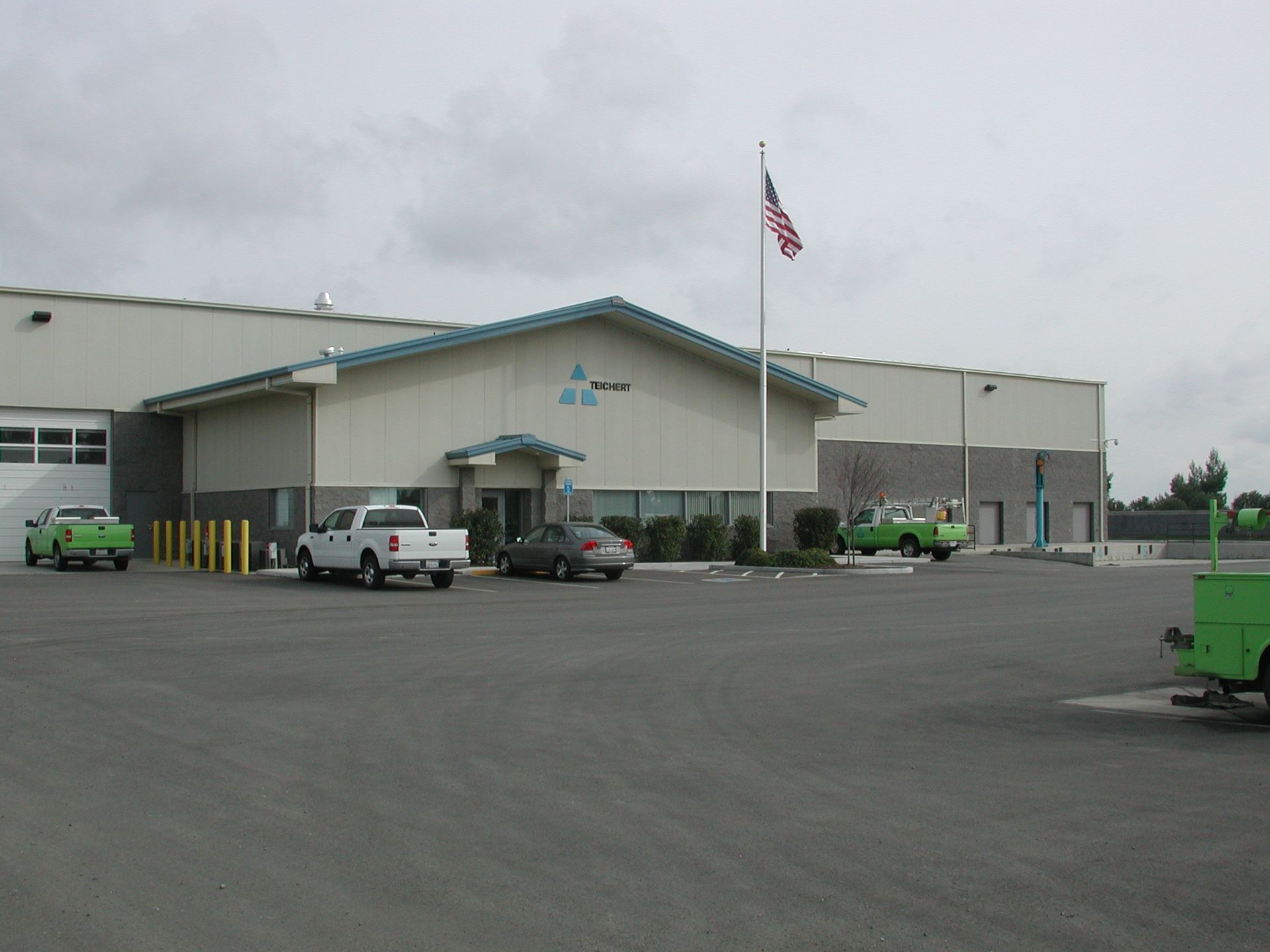 a large building with a flag in front of it