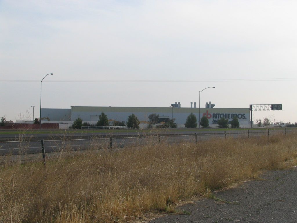 a large white building with the word hitachi on it