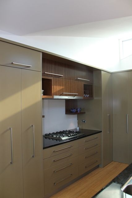 A Kitchen With A Stove Top Oven And A Sink — Motueka, NZ — Motueka Joinery Co.