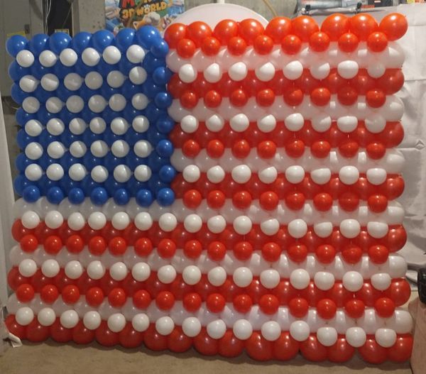An american flag made of red white and blue balloons