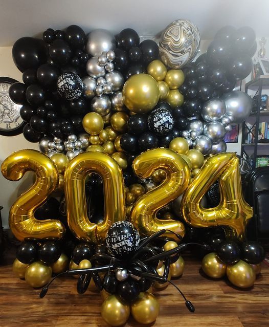 A bunch of balloons with the numbers 2024 on them
