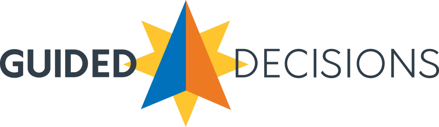 Logo of Guided Decisions with a blue and orange triangle inside a yellow starburst.