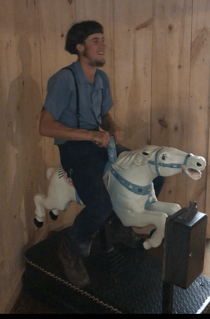 Amish riding a horse