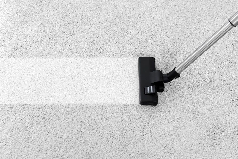 Vacuum Cleaner on A Carpet for Bond Cleaning