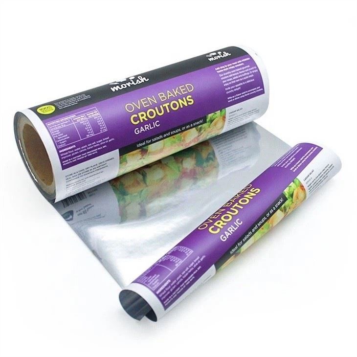 A group of rolls of flexible food packaging are sitting on a table.