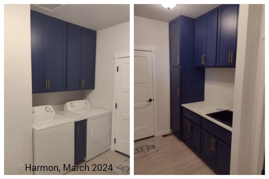 A laundry room with blue cabinets and a washer and dryer.