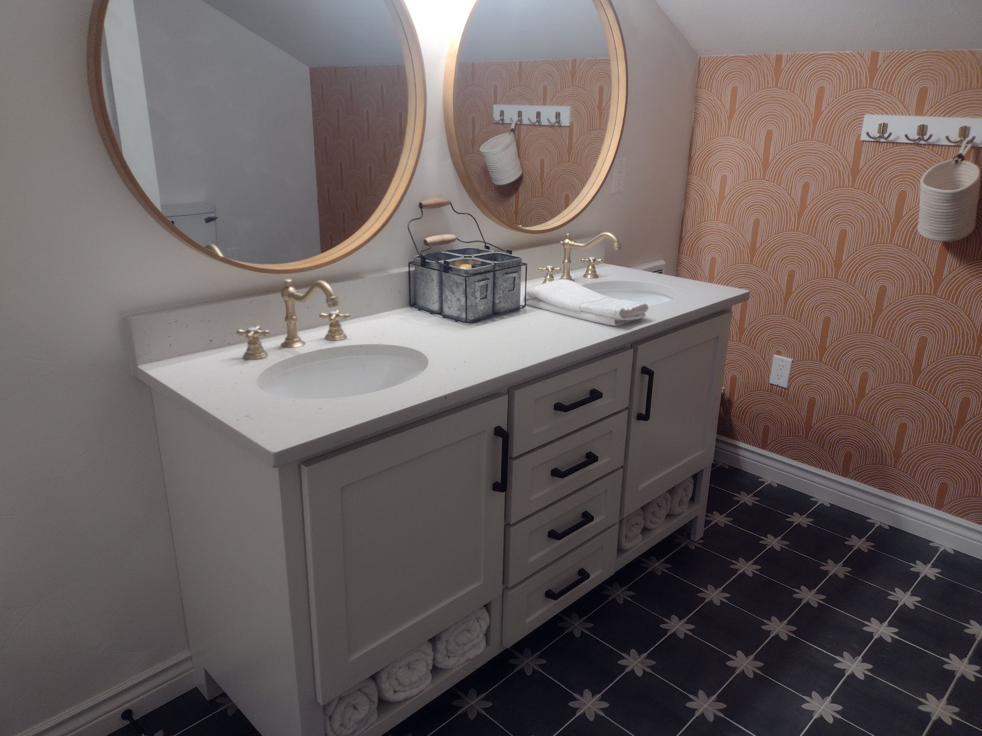 A bathroom with two sinks and two mirrors.