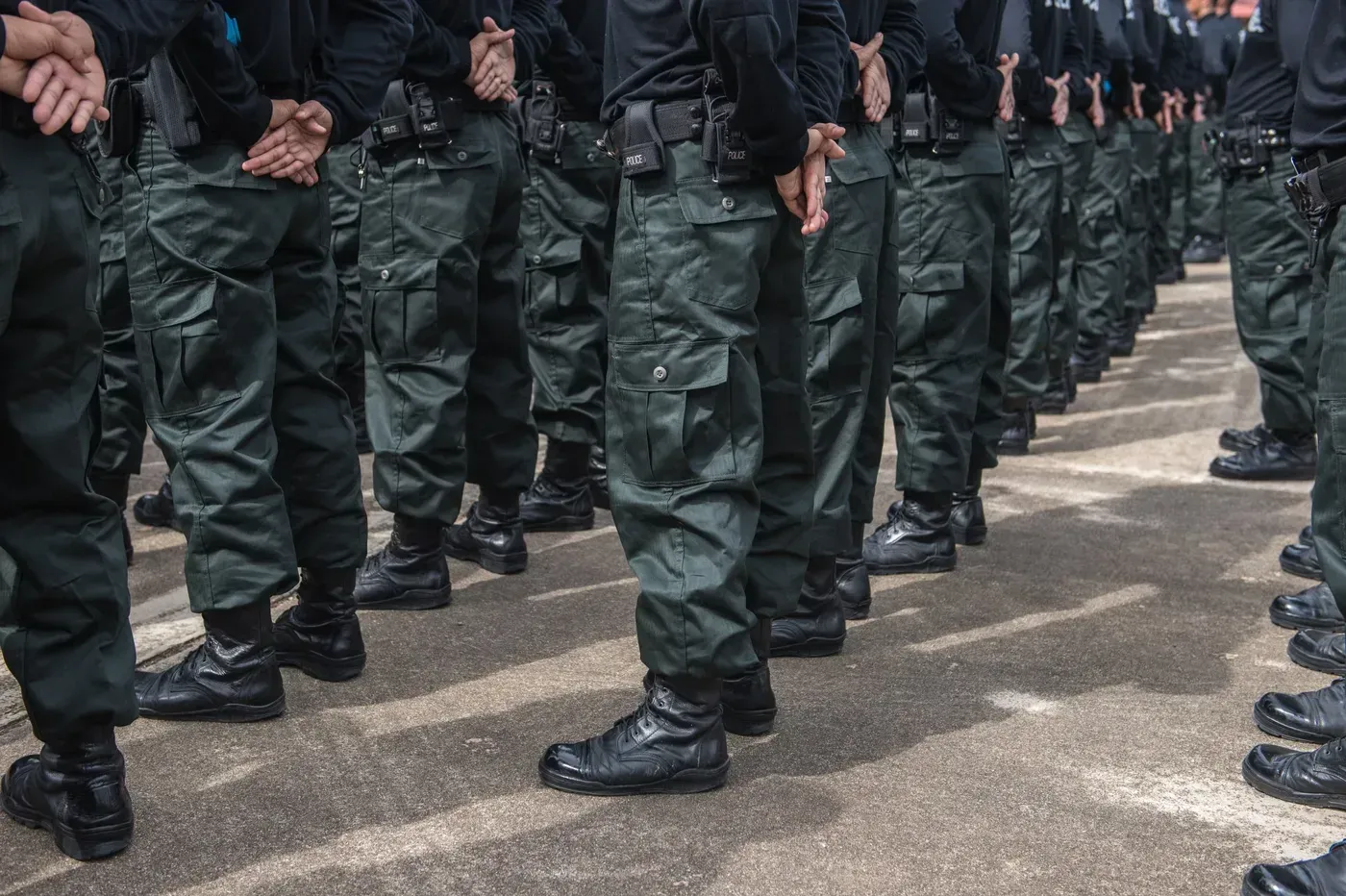 Rows of uniformed officers standing at attention.