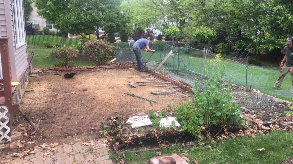 Man Designing Backyard Landscaping — Shrewsbury, MA — Warren Landscaping Man Designing Backyard Landscaping — Shrewsbury, MA — Warren Landscaping