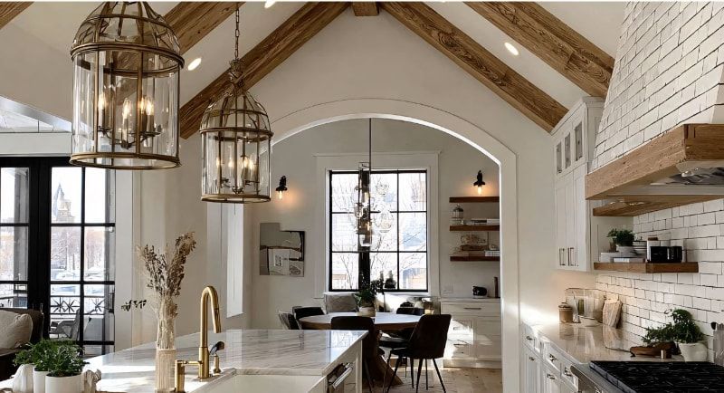 Modern Farmhouse kitchen with vaulted ceiling, wood beams, and statement light fixtures.