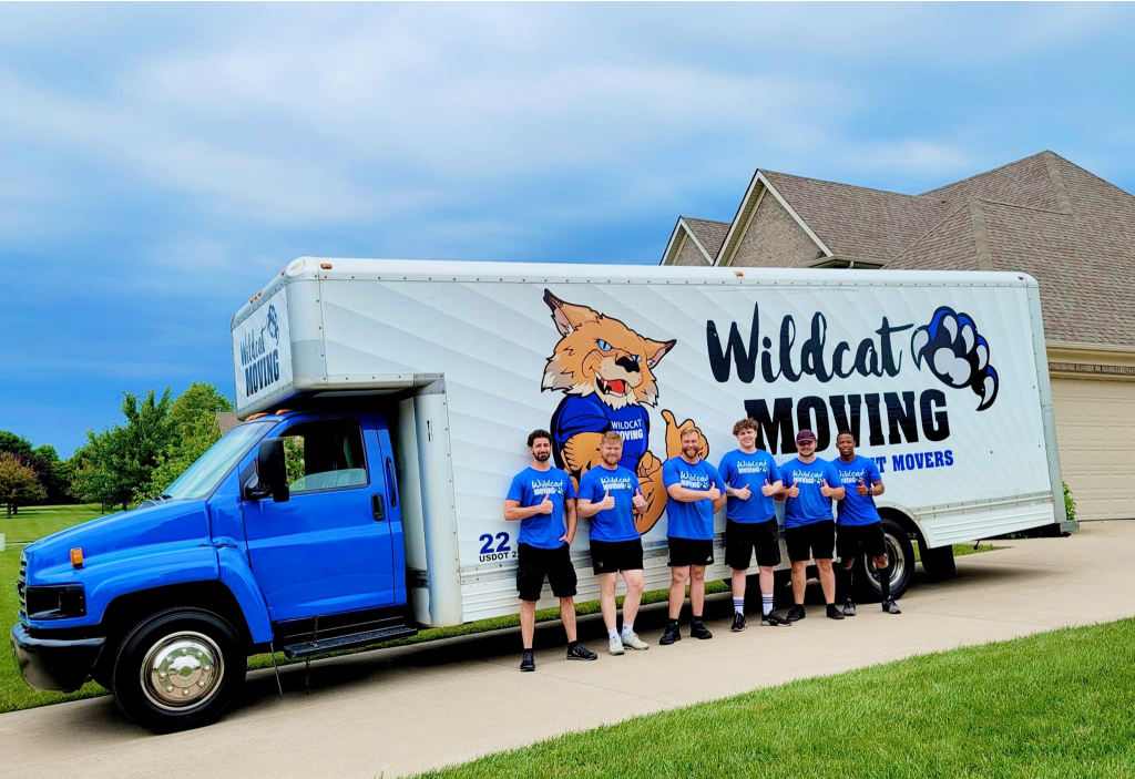 A Group of People Standing Beside the Truck - Lexington, KY - Wildcat Moving