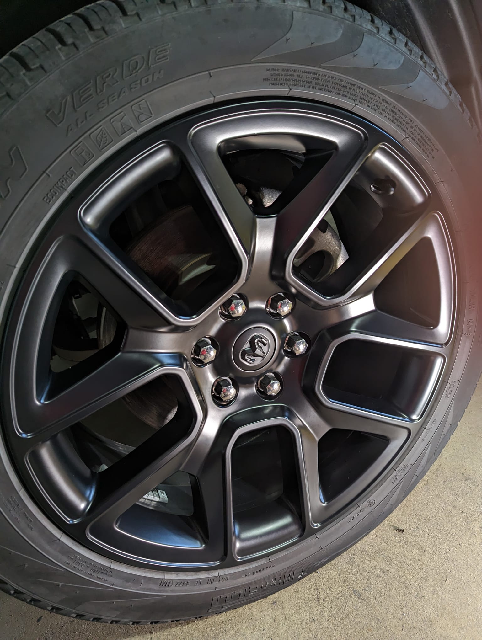 Auto Detailing - A close up of a car wheel with a tire on it