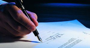 A will being signed with a fountain pen