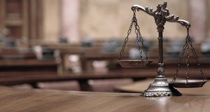 Scales of justice on a polished desk
