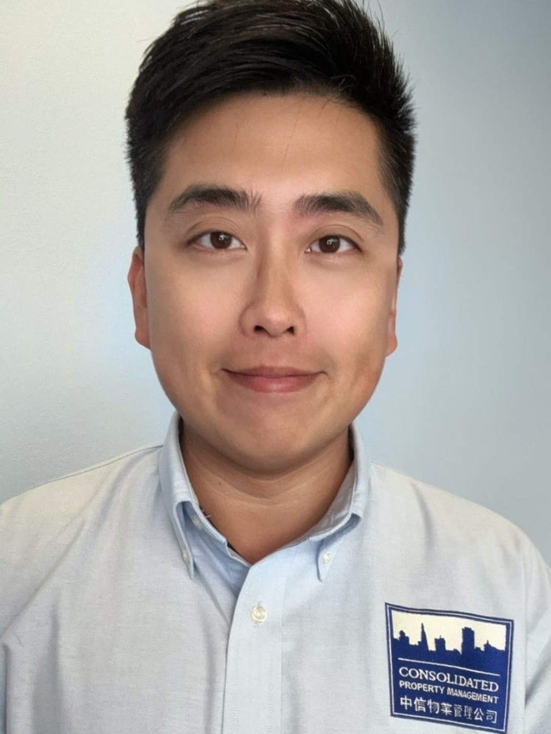 A close up of a man 's face with a smile on his face.